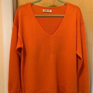 Hot orange V neck sweater.  (I bought this in Rome!)